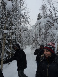 Students in snow-filled forest