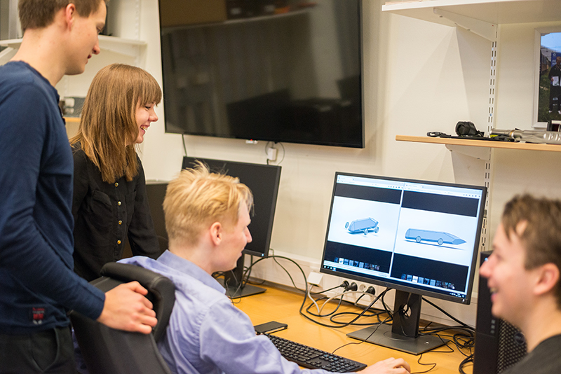 Students looking at a drawing on a computer screen