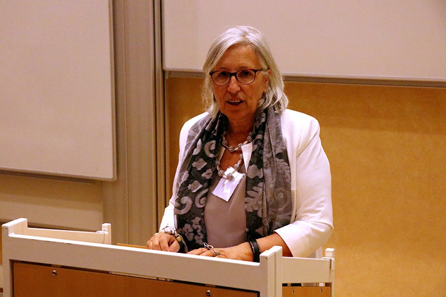 Laura Capranica standing at the front of the lecture hall