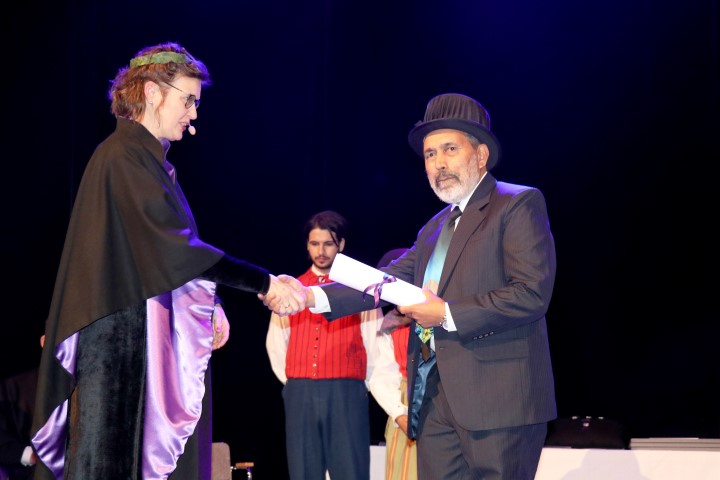 Tara Kandpal, Honorary Doctor, on the stage with the University Dean