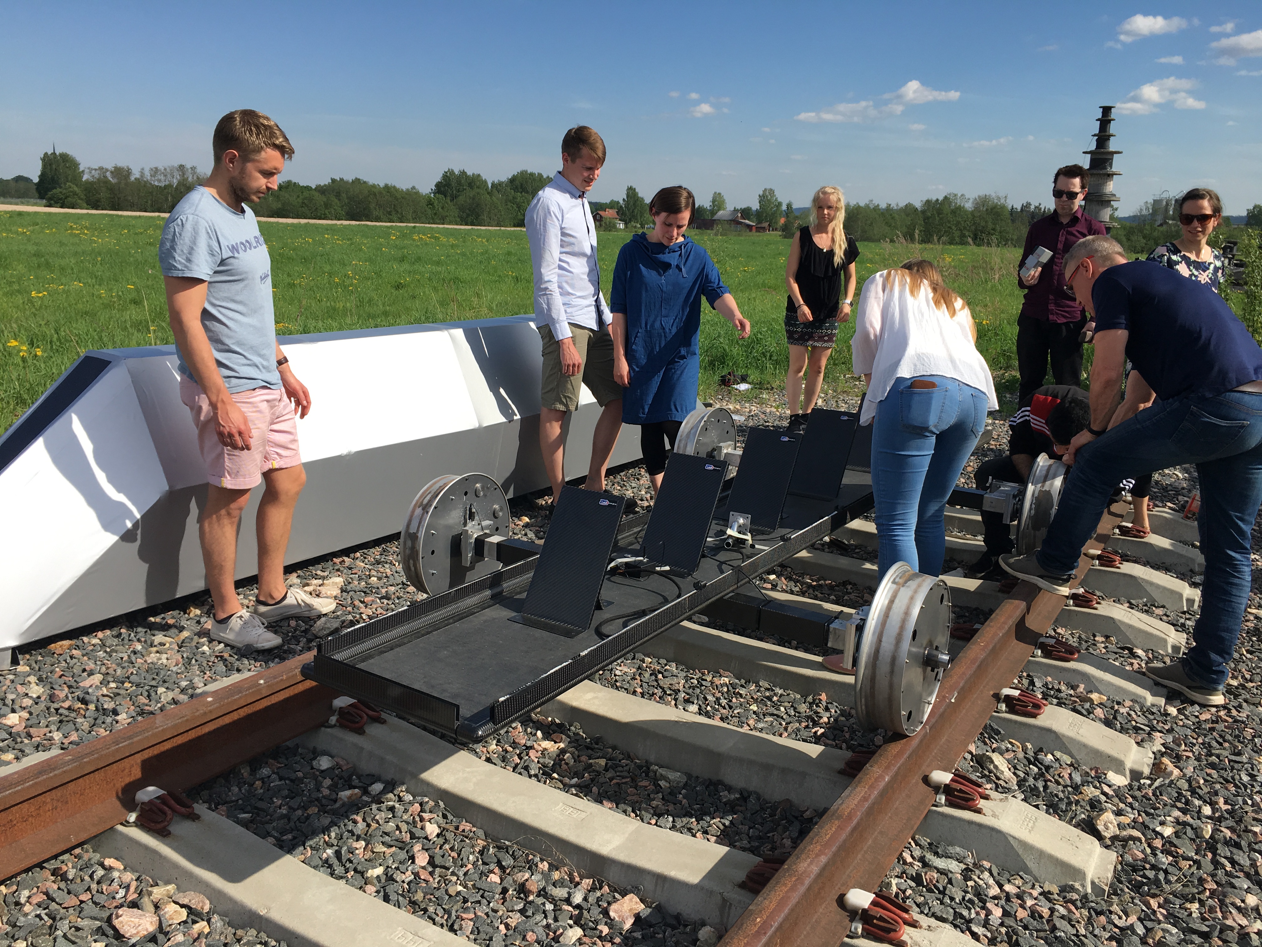 Students working on Eximus 3 on a stretch of rail