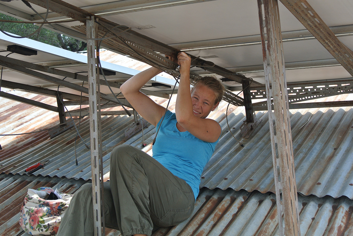 Caroline assembling solar cells in Tanzania