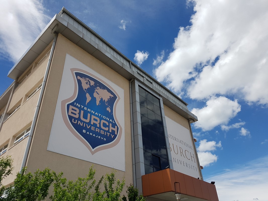 The image shows the Burch University logo on the side of the main building.