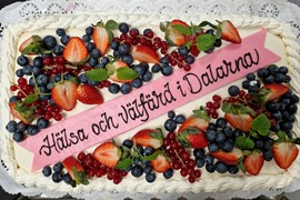 Tårta med texten Hälsa och välfärd i Dalarna